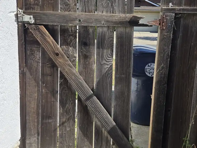 Repaired fence gate latched shut